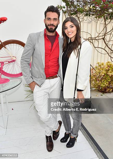 Designer Lorenzo Martone and actress Amanda Setton attend #UNCHAINME-An Art Bike Show By Martone Cycling Co. At Ron Robinson on May 21, 2015 in Santa...
