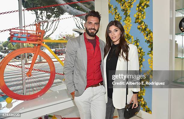 Designer Lorenzo Martone and actress Amanda Setton attend #UNCHAINME-An Art Bike Show By Martone Cycling Co. At Ron Robinson on May 21, 2015 in Santa...