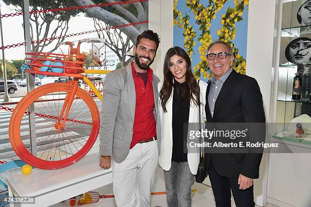 Designer Lorenzo Martone, actress Amanda Setton and retailer Ron Robinson attend #UNCHAINME-An Art Bike Show By Martone Cycling Co. At Ron Robinson...