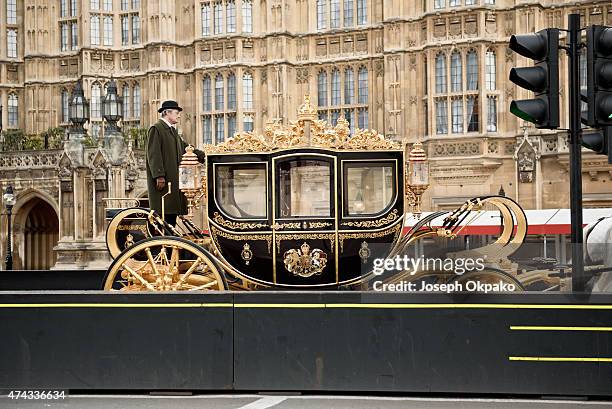 The new Diamond Jubilee state coach arrives from Buckingham Palace during the rehearsal of the State Opening of Parliament on May 22, 2015 in London,...