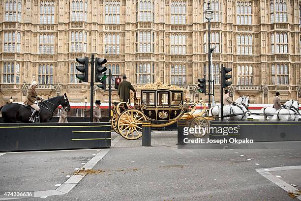 The new Diamond Jubilee state coach arrives from Buckingham Palace during the rehearsal of the State Opening of Parliament on May 22, 2015 in London,...