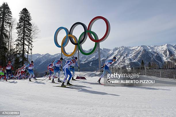 Finland's Iivo Niskanen , Italy's Roland Clara , Finland's Lari Lehtonen and Finland's Martti Jylhae compete in the Men's Cross-Country Skiing 50km...