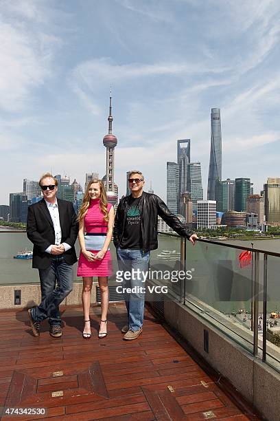 Director Brad Bird, actress Brittany Robertson and actor George Clooney attend 'Tomorrowland' photocall at The Bund on May 22, 2015 in Shanghai,...