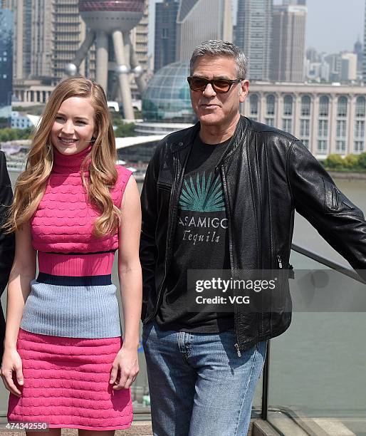 Actress Brittany Robertson and actor George Clooney attend 'Tomorrowland' photocall at The Bund on May 22, 2015 in Shanghai, China.