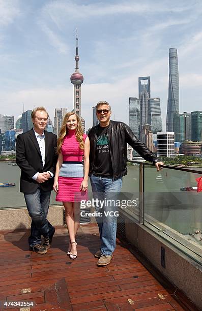 Director Brad Bird, actress Brittany Robertson and actor George Clooney attend 'Tomorrowland' photocall at The Bund on May 22, 2015 in Shanghai,...