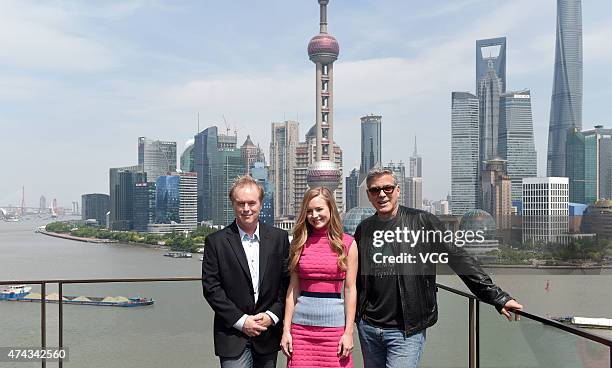 Director Brad Bird, actress Brittany Robertson and actor George Clooney attend 'Tomorrowland' photocall at The Bund on May 22, 2015 in Shanghai,...