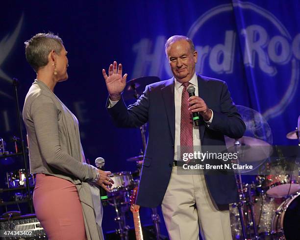 Political commentator Bill O'Reilly speaks on stage as television journalist Jennifer Griffin looks on during the Rock The Boat Fleet Week Kickoff...