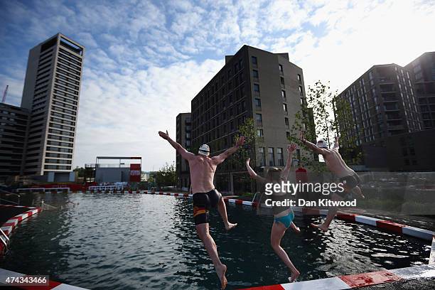 Members of the East German Ladies' swimming team jump in the new 'King's Cross Pond Club' outdoor swimming pool on May 22, 2015 in London, England....