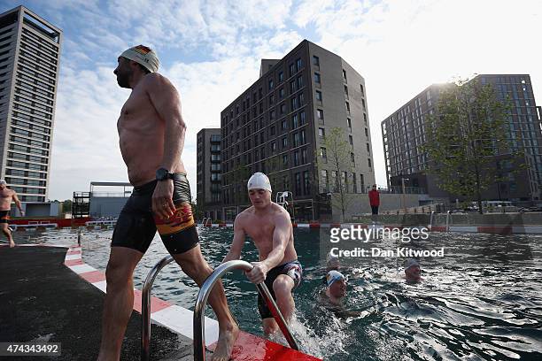 Members of the East German Ladies' swimming team leave the new 'King's Cross Pond Club' outdoor swimming pool on May 22, 2015 in London, England. The...