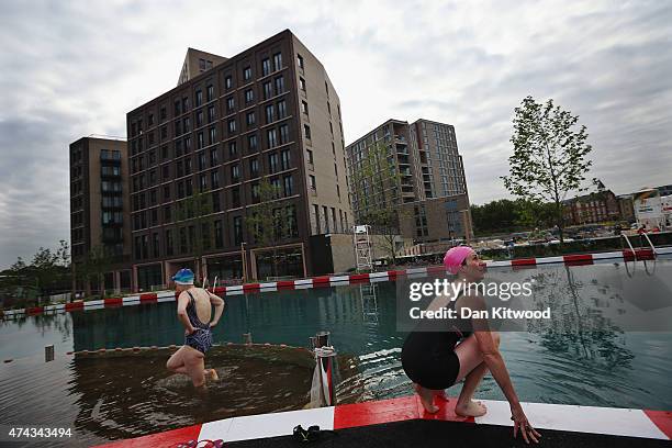Members of the public use in the new 'King's Cross Pond Club' outdoor swimming pool on May 22, 2015 in London, England. The 40 metre pool is purified...