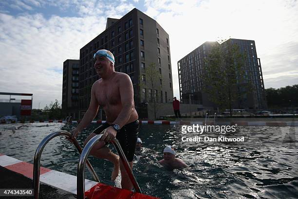 Member of the East German Ladies' swimming team leaves the new 'King's Cross Pond Club' outdoor swimming pool on May 22, 2015 in London, England. The...
