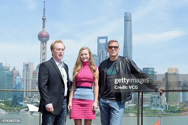 Director Brad Bird, actress Britt Robertson and actor George Clooney attend 'Tomorrowland' photocall at The Bund on May 22, 2015 in Shanghai, China.