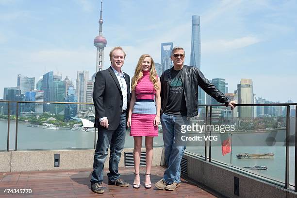 Director Brad Bird, actress Britt Robertson and actor George Clooney attend 'Tomorrowland' photocall at The Bund on May 22, 2015 in Shanghai, China.