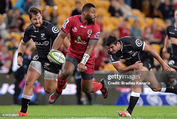 Samu Kerevi of the Reds breaks away from the defence during the round 15 Super Rugby match between the Reds and the Sharks at Suncorp Stadium on May...