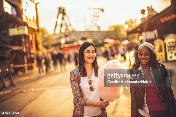 friends in the amusement park - vienna holiday fair stock pictures, royalty-free photos & images