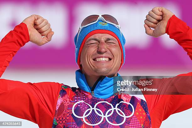 Gold medalist Alexander Legkov of Russia celebrates during the flower ceremony for the Men's 50 km Mass Start Free during day 16 of the Sochi 2014...
