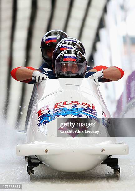 Pilot Alexander Zubkov, Alexey Negodaylo, Dmitry Trunenkov and Alexey Voevoda of Russia team 1 finish a run during the Men's Four-Man Bobsleigh on...