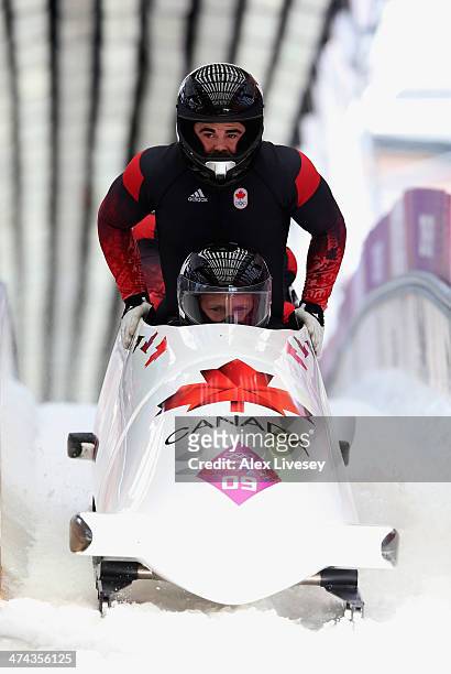 Pilot Lyndon Rush, Lascelles Brown, David Bissett and Neville Wright of Canada team 2 finish a run during the Men's Four-Man Bobsleigh on Day 16 of...