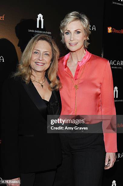 Jeannie Elias and Jane Lynch attend the Santa Barbara Wine Auction 2014: A Benefit for Direct Relief at Bacara Resort & Spa on February 22, 2014 in...