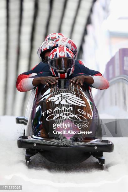 Pilot Lamin Deen, John Baines, Andrew Matthews and Ben Simons of Great Britain team 2 finish a run during the Men's Four-Man Bobsleigh on Day 16 of...