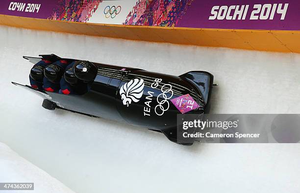 Pilot John James Jackson, Stuart Benson, Bruce Tasker and Joel Fearon of Great Britain team 1 make a run during the Men's Four-Man Bobsleigh on Day...