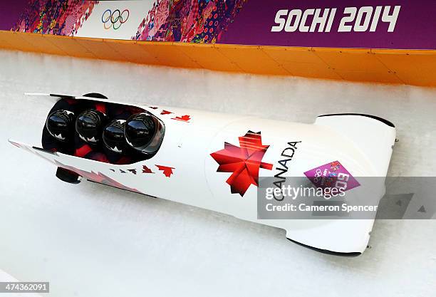 Pilot Lyndon Rush, Lascelles Brown, David Bissett and Neville Wright of Canada team 2 make a run during the Men's Four-Man Bobsleigh on Day 16 of the...