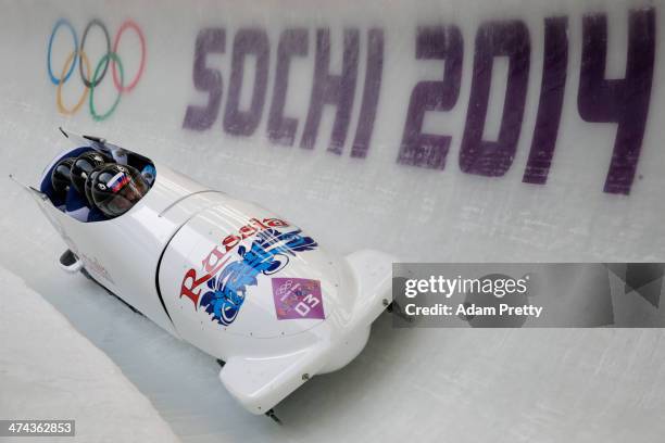 Pilot Alexander Zubkov, Alexey Negodaylo, Dmitry Trunenkov and Alexey Voevoda of Russia team 1 make a run during the Men's Four-Man Bobsleigh on Day...