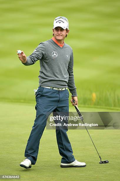 Emiliano Grillo of Argentina acknowledges the crowd after an eagle on the 18th hole during day 2 of the BMW PGA Championship at Wentworth on May 22,...