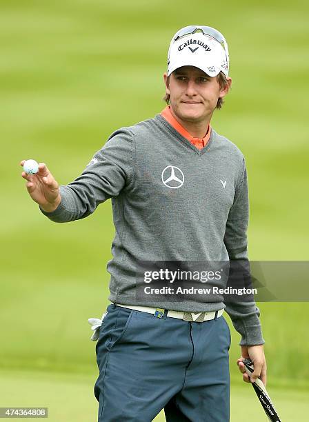 Emiliano Grillo of Argentina acknowledges the crowd after an eagle on the 18th hole during day 2 of the BMW PGA Championship at Wentworth on May 22,...