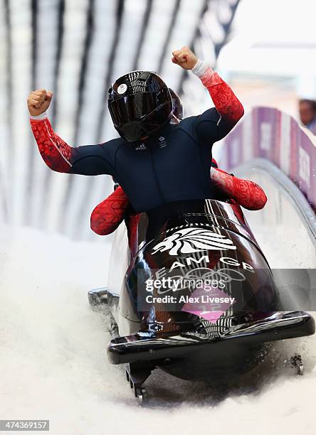 Pilot John James Jackson, Stuart Benson, Bruce Tasker and Joel Fearon of Great Britain team 1 finish a run during the Men's Four-Man Bobsleigh on Day...