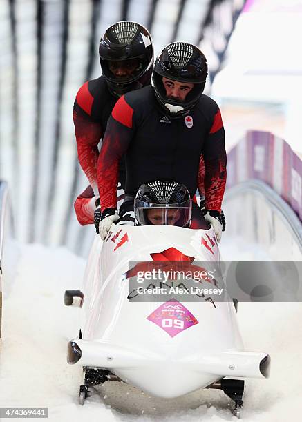 Pilot Lyndon Rush, Lascelles Brown, David Bissett and Neville Wright of Canada team 2 finish a run during the Men's Four-Man Bobsleigh on Day 16 of...