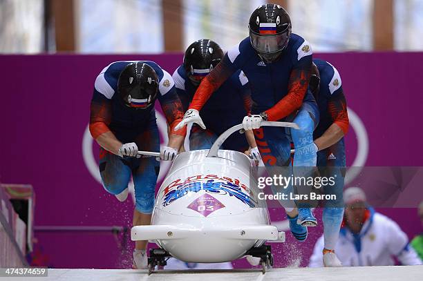 Pilot Alexander Zubkov, Alexey Negodaylo, Dmitry Trunenkov and Alexey Voevoda of Russia team 1 make a run during the Men's Four-Man Bobsleigh on Day...