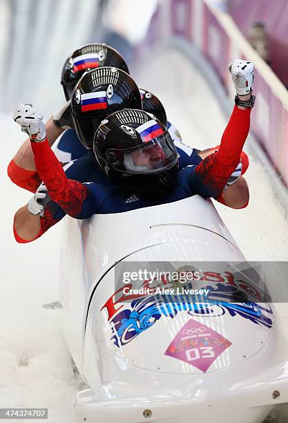 Pilot Alexander Zubkov, Alexey Negodaylo, Dmitry Trunenkov and Alexey Voevoda of Russia team 1 celebrate winning the gold medal during the Men's...