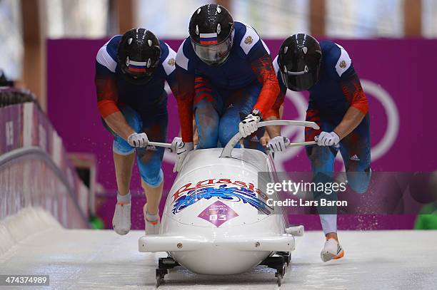 Pilot Alexander Zubkov, Alexey Negodaylo, Dmitry Trunenkov and Alexey Voevoda of Russia team 1 make a run during the Men's Four-Man Bobsleigh on Day...