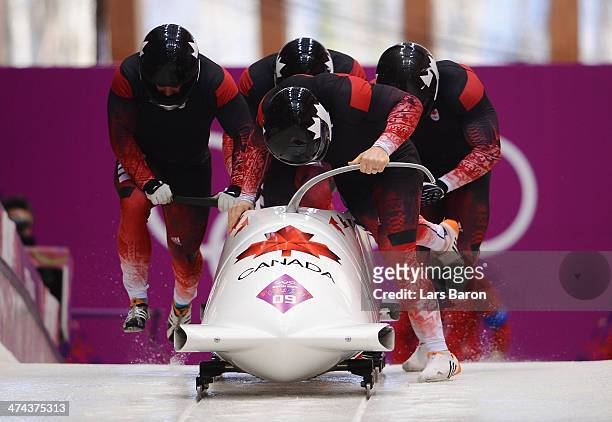 Pilot Lyndon Rush, Lascelles Brown, David Bissett and Neville Wright of Canada team 2 make a run during the Men's Four-Man Bobsleigh on Day 16 of the...