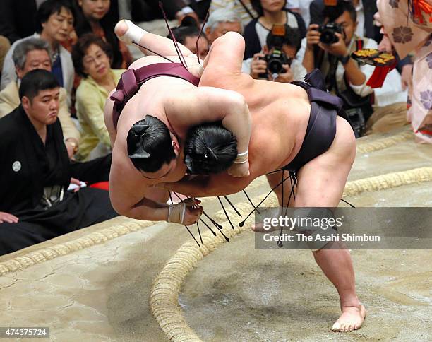 Myogiryu throws Tokushoryu to win during day thirteen of the Grand Sumo Summer Tournament at Ryogoku Kokugikan on May 22, 2015 in Tokyo, Japan.