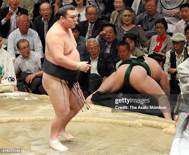 Ikioi reacts after beating Sadanoumi to win during day thirteen of the Grand Sumo Summer Tournament at Ryogoku Kokugikan on May 22, 2015 in Tokyo,...