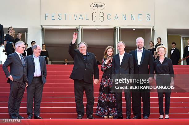 French actor Gerard Depardieu waves as he poses with French actress Isabelle Huppert , French director Guillaume Nicloux , US actor Dan Warner , the...