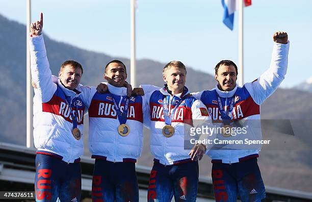 Gold medalist Russia team 1 celebrates on the podium during the medal ceremony for the Four-Man Bobsleigh on Day 16 of the Sochi 2014 Winter Olympics...