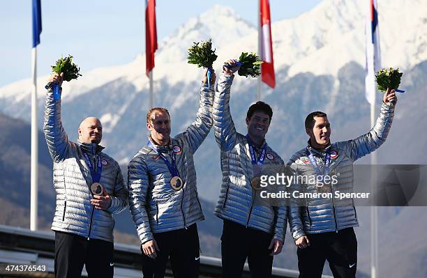 Bronze medalists the United States team 1 celebrate on the podium during the medal ceremony for the Four-Man Bobsleigh on Day 16 of the Sochi 2014...