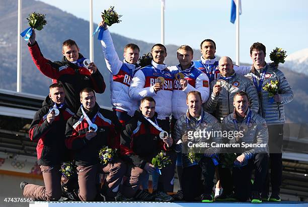 Silver medalist Latvia team 1, gold medalist Russia team 1 and bronze medalist the United States team 1 on the podium during the medal ceremony for...