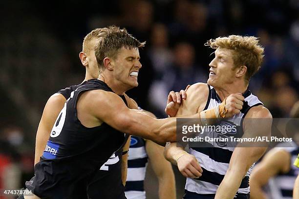 Cameron Wood of the Blues and Josh Caddy of the Cats wrestle during the round eight AFL match between the Geelong Cats and the Carlton Blues at...