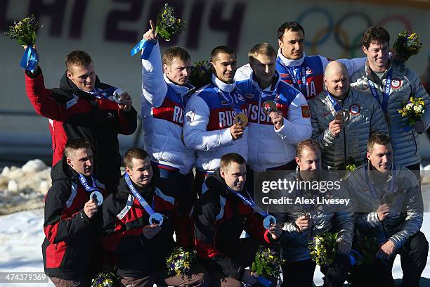 Silver medalist Latvia team 1, gold medalist Russia team 1 and bronze medalist the United States team 1 on the podium during the medal ceremony for...