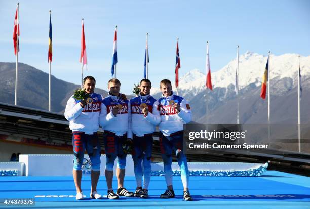 Gold medalists Russia team 1 celebrate on the podium during the medal ceremony for the Four-Man Bobsleigh on Day 16 of the Sochi 2014 Winter Olympics...