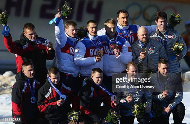 Silver medalist Latvia team 1, gold medalist Russia team 1 and bronze medalist the United States team 1 on the podium during the medal ceremony for...