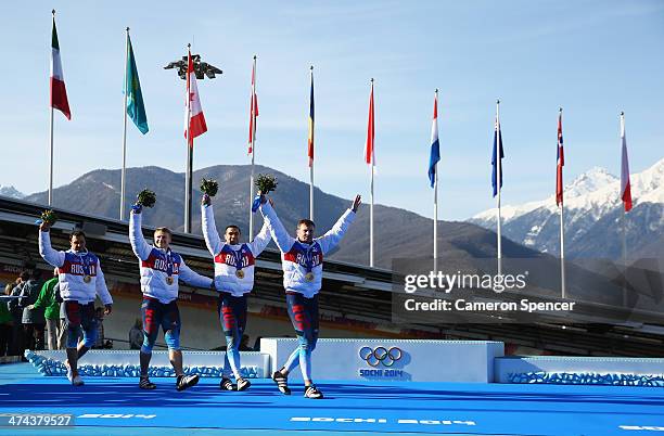 Gold medalists Russia team 1 celebrate during the medal ceremony for the Four-Man Bobsleigh on Day 16 of the Sochi 2014 Winter Olympics at Sliding...