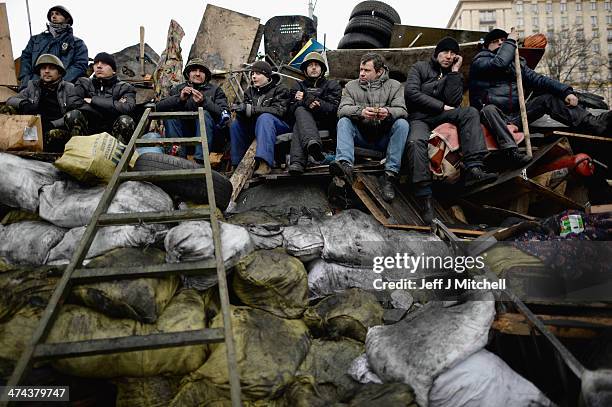 Men remain on front line barricades near to Independence Square on February 23, 2014 in Kiev, Ukraine. Prime Minister Yanukovych is said to have left...