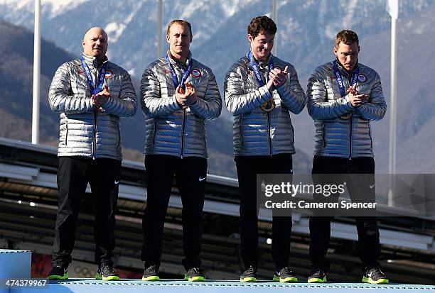 Bronze medalists the United States team 1 celebrate on the podium during the medal ceremony for the Four-Man Bobsleigh on Day 16 of the Sochi 2014...