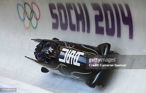Pilot Steven Holcomb, Curtis Tomasevicz, Steven Langton and Christopher Fogt of the United States team 1 make a run during the Men's Four Man...
