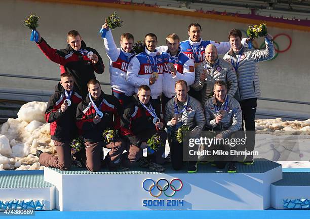 Silver medalist Latvia team 1, gold medalist Russia team 1 and bronze medalist the United States team 1 on the podium during the medal ceremony for...